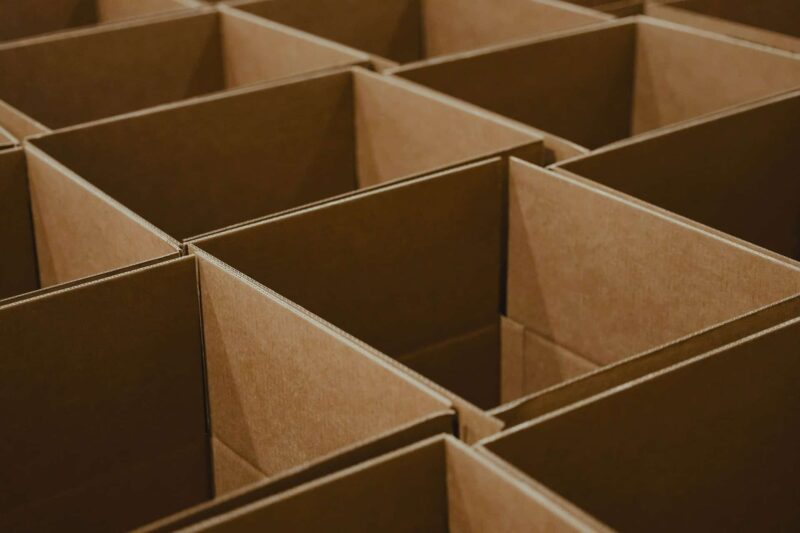 Empty cardboard boxes in a grid. Our packing tips include the best way to get free moving boxes.