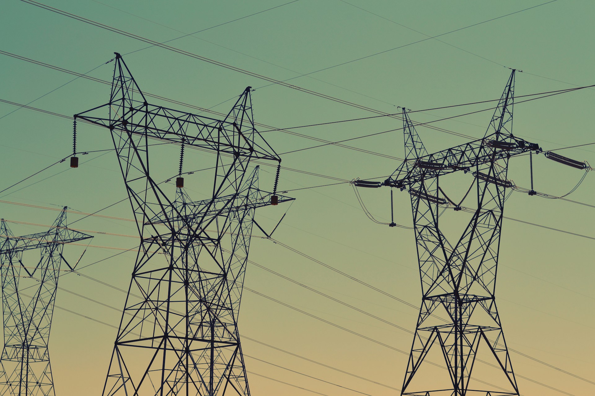 Power lines against a sunset.