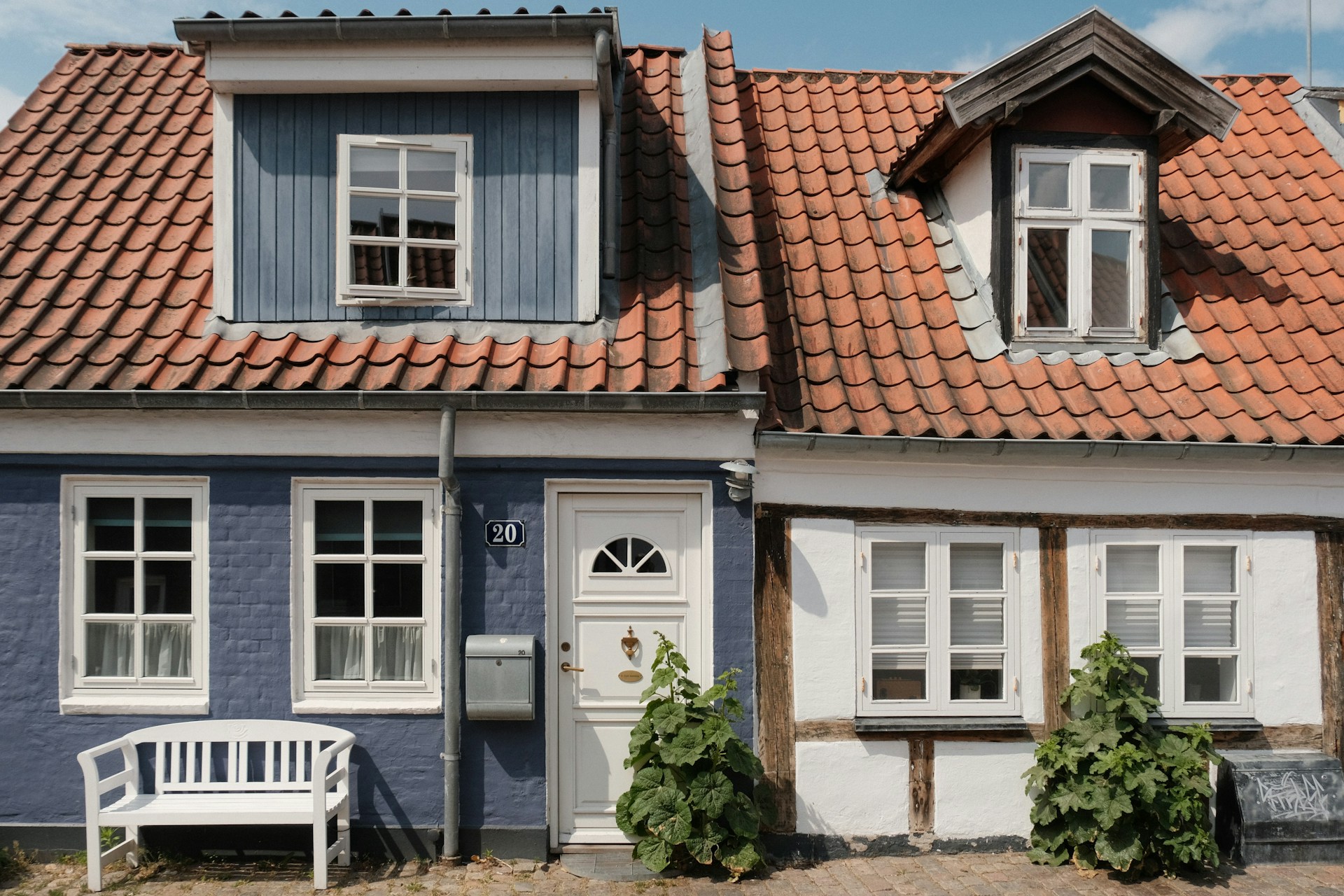 Two small terraced houses next to each other.